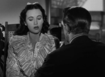 Movie still from “Casanova Brown” (1944), directed by Sam Wood – A man and a woman talking to each other; Close Up shot, Over the shoulder angle