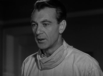 Movie still from “Casanova Brown” (1944), directed by Sam Wood – An older man wearing a white shirt looking at the camera; Close Up shot, Low angle