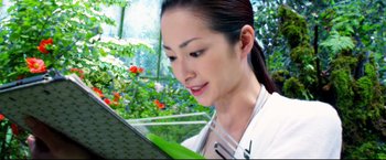 Movie still from “Casshern” (2004), directed by Kazuaki Kiriya – A woman is looking at a computer screen; Extreme Close Up shot, Low angle