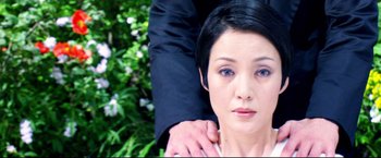 Movie still from “Casshern” (2004), directed by Kazuaki Kiriya – A woman's face and a man's arm; Close Up shot, High angle