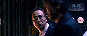 Movie still from “Casshern” (2004), directed by Kazuaki Kiriya – A man and another man are looking at each other; Close Up shot, Over the shoulder angle