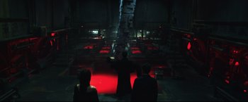 Movie still from “Casshern” (2004), directed by Kazuaki Kiriya – A group of people sitting in a dark room; Wide shot, High angle