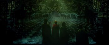 Movie still from “Casshern” (2004), directed by Kazuaki Kiriya – A group of people standing in front of a projection screen; Extreme Wide shot, High angle