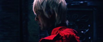 Movie still from “Casshern” (2004), directed by Kazuaki Kiriya – A person wearing a red jacket; Close Up shot, Low angle