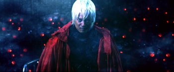 Movie still from “Casshern” (2004), directed by Kazuaki Kiriya – A man in a red jacket standing next to a forest; Medium shot, Low angle