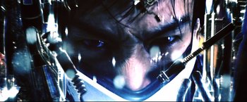 Movie still from “Casshern” (2004), directed by Kazuaki Kiriya – A man's face with blue eyes; Extreme Close Up shot, Low angle