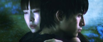 Movie still from “Casshern” (2004), directed by Kazuaki Kiriya – A woman and a man are looking at each other in the dark; Close Up shot, Over the shoulder angle