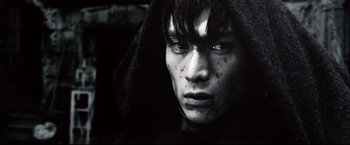 Movie still from “Casshern” (2004), directed by Kazuaki Kiriya – A young man wearing a hooded jacket and staring at the camera; Close Up shot, Low angle