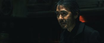 Movie still from “Casshern” (2004), directed by Kazuaki Kiriya – A person with long black hair; Close Up shot, Low angle