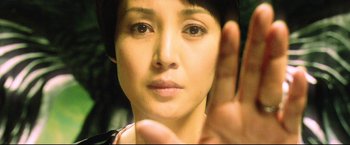 Movie still from “Casshern” (2004), directed by Kazuaki Kiriya – A person holding their hand up; Close Up shot, High angle
