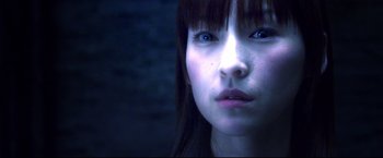 Movie still from “Casshern” (2004), directed by Kazuaki Kiriya – A young woman's face in the dark; Close Up shot, High angle