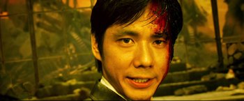 Movie still from “Casshern” (2004), directed by Kazuaki Kiriya – A young man with a blood soaked forehead; Close Up shot, High angle