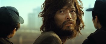 A person with long hair and a beard