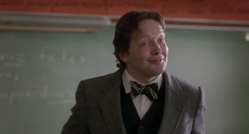 Movie still from “The Craft” (1996), directed by Andrew Fleming – A man wearing a suit and tie and a bow tie; Close Up shot, Low angle