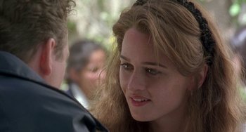 Movie still from “The Craft” (1996), directed by Andrew Fleming – A young woman with long hair wearing a tiara; Close Up shot, Over the shoulder angle