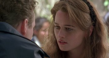 Movie still from “The Craft” (1996), directed by Andrew Fleming – A person looking at the camera; Close Up shot, Over the shoulder angle