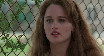 Movie still from “The Craft” (1996), directed by Andrew Fleming – A person with long brown hair; Close Up shot, Over the shoulder angle