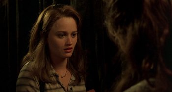 Movie still from “The Craft” (1996), directed by Andrew Fleming – A woman looking at herself in the mirror; Close Up shot, Over the shoulder angle