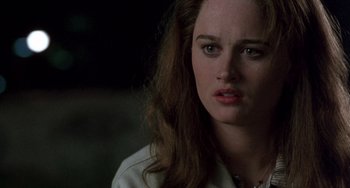 Movie still from “The Craft” (1996), directed by Andrew Fleming – A person with long hair; Close Up shot, Over the shoulder angle