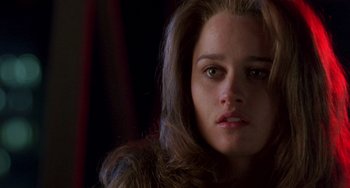 Movie still from “The Craft” (1996), directed by Andrew Fleming – A person with long brown hair; Close Up shot, Low angle