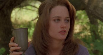 Movie still from “The Craft” (1996), directed by Andrew Fleming – A person with long brown hair; Close Up shot, Over the shoulder angle