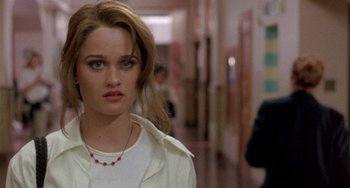 Movie still from “The Craft” (1996), directed by Andrew Fleming – A person wearing a white shirt; Close Up shot, Over the shoulder angle