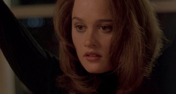 Movie still from “The Craft” (1996), directed by Andrew Fleming – A person with long brown hair; Close Up shot, Over the shoulder angle
