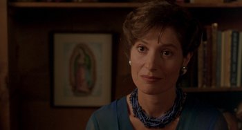 Movie still from “The Craft” (1996), directed by Andrew Fleming – A person wearing a necklace; Close Up shot, Over the shoulder angle