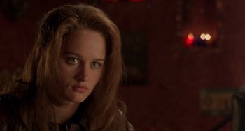 Movie still from “The Craft” (1996), directed by Andrew Fleming – A person with long brown hair; Close Up shot, Over the shoulder angle