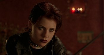 Movie still from “The Craft” (1996), directed by Andrew Fleming – A person wearing a leather jacket; Close Up shot, Over the shoulder angle