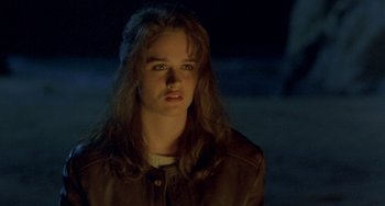 Movie still from “The Craft” (1996), directed by Andrew Fleming – A woman with long brown hair wearing a brown jacket; Close Up shot, Over the shoulder angle