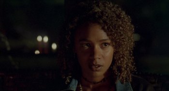 Movie still from “The Craft” (1996), directed by Andrew Fleming – A person with curly hair; Close Up shot, Low angle
