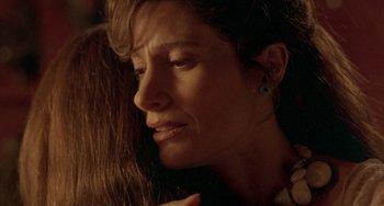 Movie still from “The Craft” (1996), directed by Andrew Fleming – A person with their eyes closed; Close Up shot, Over the shoulder angle