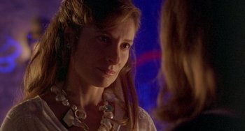 Movie still from “The Craft” (1996), directed by Andrew Fleming – A person wearing a necklace; Close Up shot, Over the shoulder angle