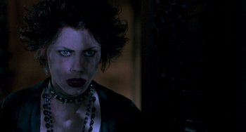 Movie still from “The Craft” (1996), directed by Andrew Fleming – A person wearing a necklace; Close Up shot, Over the shoulder angle