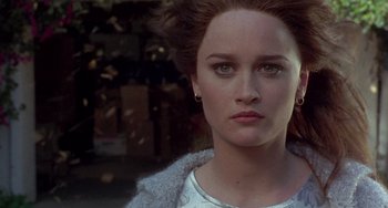 Movie still from “The Craft” (1996), directed by Andrew Fleming – A person wearing a white shirt; Close Up shot, Over the shoulder angle