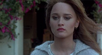 Movie still from “The Craft” (1996), directed by Andrew Fleming – A person wearing a jacket; Close Up shot, High angle