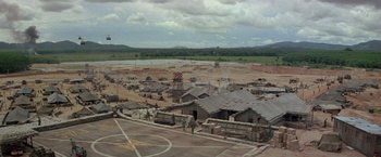 Movie still from “Casualties of War” (1989), directed by Brian De Palma – An aerial view of an area that has a lot of buildings; Extreme Wide shot, High angle