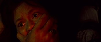 Movie still from “Casualties of War” (1989), directed by Brian De Palma – A person holding their hands up to their face; Extreme Close Up shot, Low angle