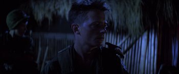 Movie still from “Casualties of War” (1989), directed by Brian De Palma – A person with a cell phone; Close Up shot, Low angle