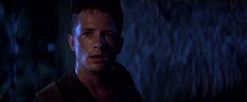 Movie still from “Casualties of War” (1989), directed by Brian De Palma – A young man is looking into the camera; Close Up shot, Low angle