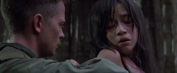 Movie still from “Casualties of War” (1989), directed by Brian De Palma – A man and a woman are crying in a room; Close Up shot, Over the shoulder angle