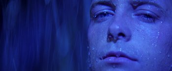 Movie still from “Casualties of War” (1989), directed by Brian De Palma – A woman's face in the rain; Extreme Close Up shot, Low angle