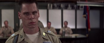 Movie still from “Casualties of War” (1989), directed by Brian De Palma – A person wearing a military uniform; Close Up shot, Low angle