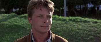 Movie still from “Casualties of War” (1989), directed by Brian De Palma – A person wearing a brown jacket; Close Up shot, Low angle