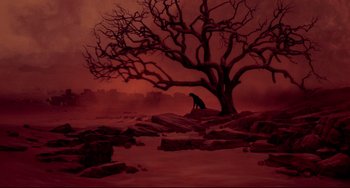 Movie still from “Cat People” (1982), directed by Paul Schrader – A dog sitting under a tree in the middle of the night; Extreme Wide shot, High angle