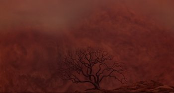 Movie still from “Cat People” (1982), directed by Paul Schrader – A bare tree in the middle of a red sky; Extreme Wide shot, Low angle