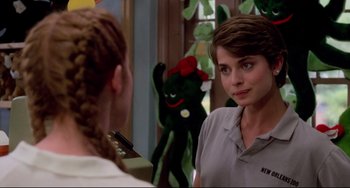 Movie still from “Cat People” (1982), directed by Paul Schrader – A woman standing in front of a mirror looking at herself in the mirror; Close Up shot, Over the shoulder angle