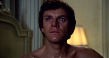 Movie still from “Cat People” (1982), directed by Paul Schrader – A person with blue eyes looking up; Close Up shot, Low angle