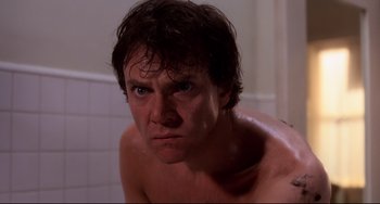 Movie still from “Cat People” (1982), directed by Paul Schrader – A person with wet hair; Close Up shot, Low angle